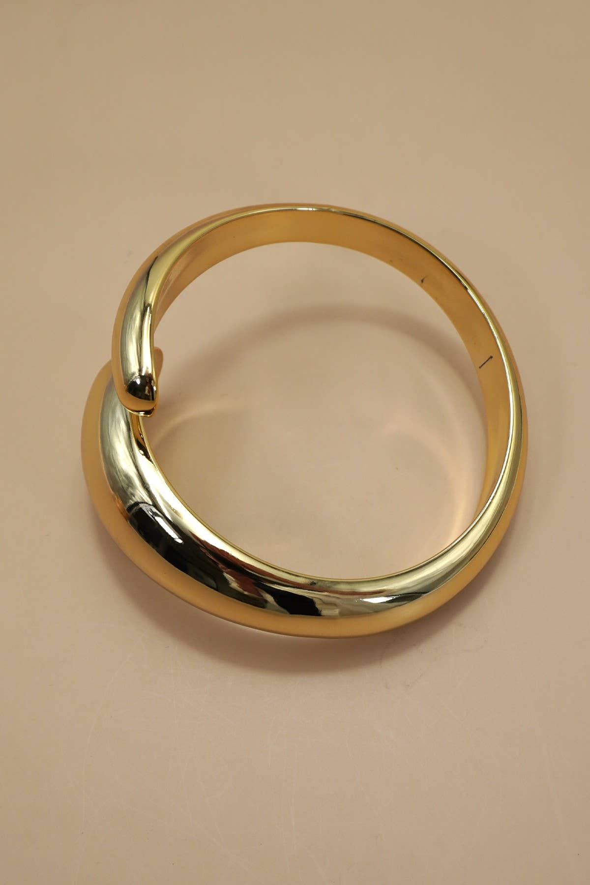 Teardrop-Shaped Gold Bangle Bracelet